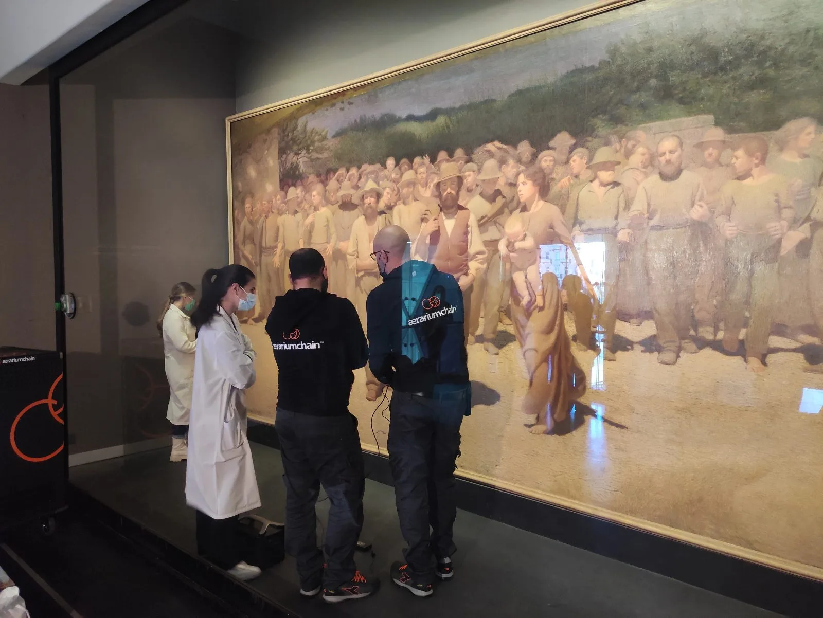The AerariumChain team at work in front of Il Quarto Stato, Museo del Novecento, Milan