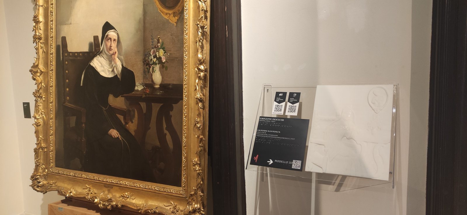 A tactile relief of a painting, made from its digital twin, next to the original